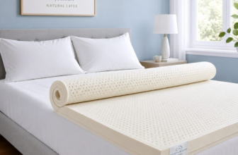 Sleep and Beyond myComfort natural latex mattress topper unrolled on a king bed with white sheets