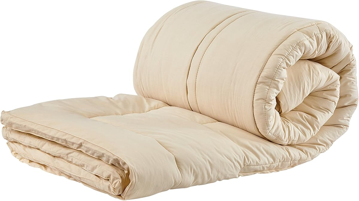 Sleep and Beyond myMerino organic wool mattress topper on bed