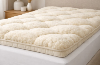 Sleep and Beyond myTopper wool mattress topper in cream on bed