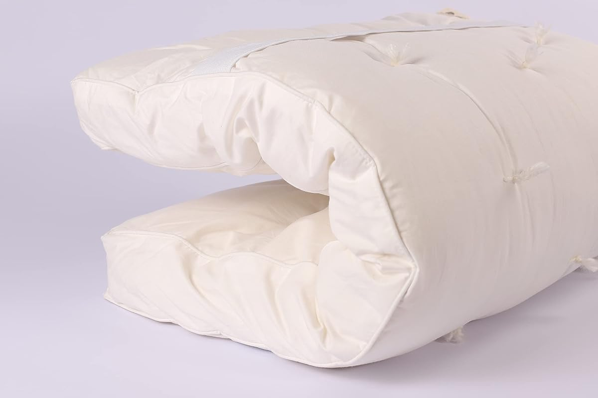 Sleep & Beyond myWoolly Latex Topper on a bed