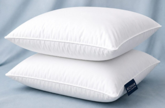 Beckham Hotel Collection white down alternative bed pillows set of 2 on light blue background