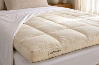 Sleep and Beyond myMerino cream wool mattress topper on queen bed with white sheets