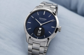 Withings ScanWatch Nova hybrid smartwatch on light blue surface