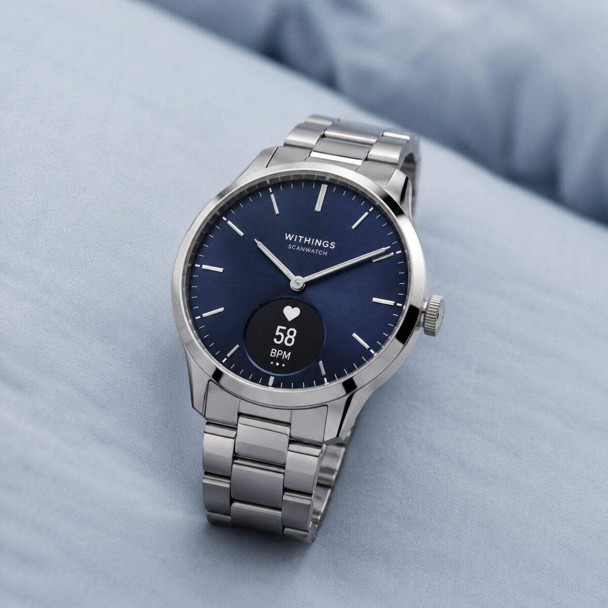 Withings ScanWatch Nova hybrid smartwatch on light blue surface